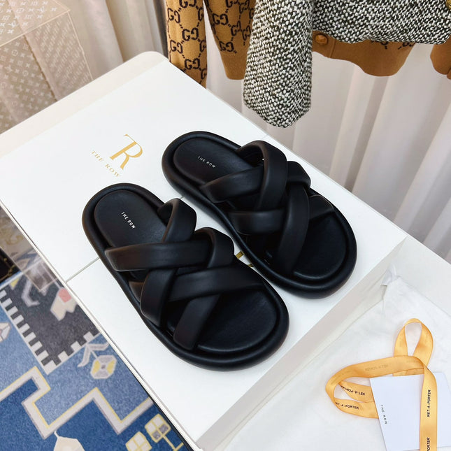THE ROW 26S CROSSED PADDED SLIDES IN BLACK CALFSKIN