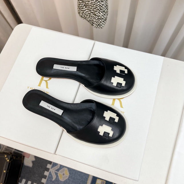 THE ROW 26S PIXEL APPLIQUE MULES IN BLACK CALFSKIN
