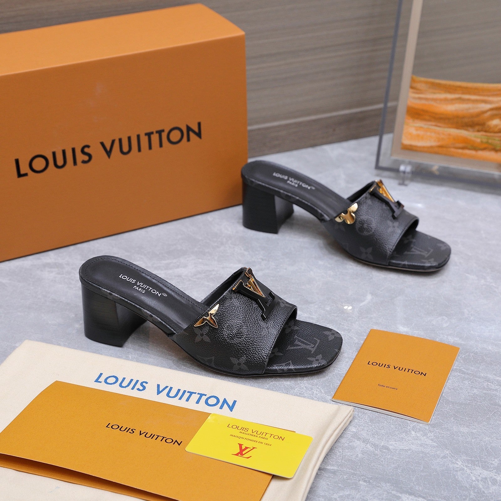 LV 26S BLOCK HEEL MULE SANDALS 55MM IN BLACK MONOGRAM CALFSKIN GOLD HARDWARE