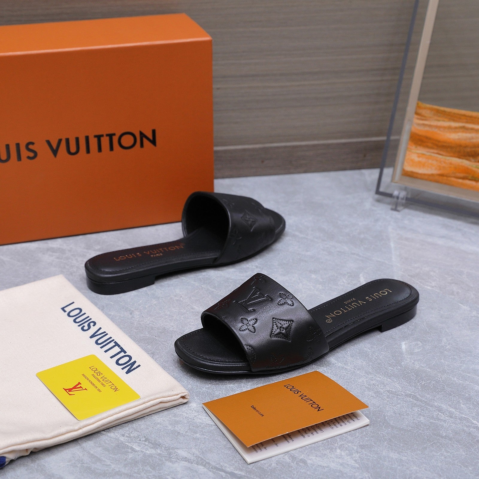 LV 26S FLAT SLIDE SANDALS IN BLACK CALFSKIN EMBOSSED MONOGRAM LOGO