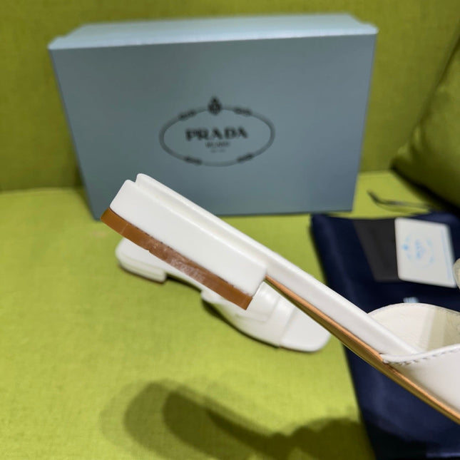 PRADA 25S SLIDES IN WHITE CALFSKIN