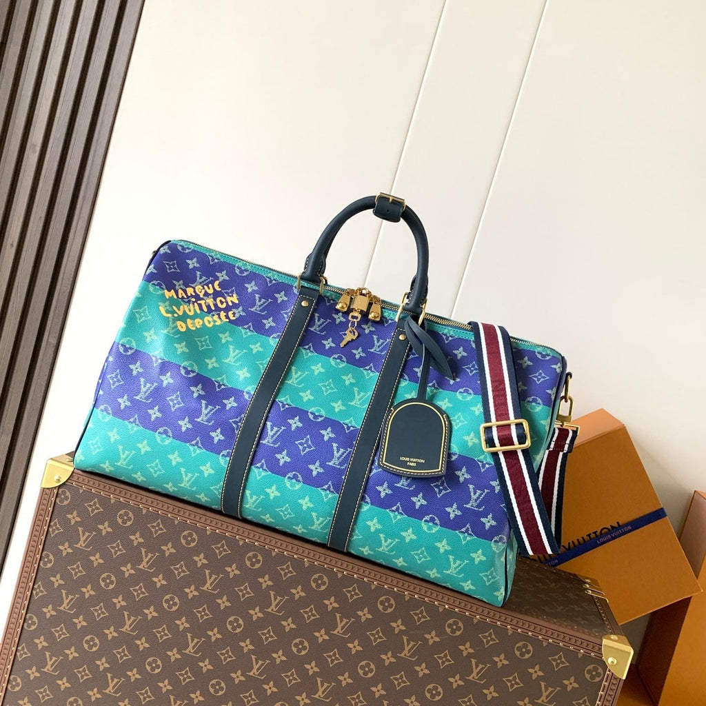 LV 26S KEEPALL 50 IN BLUE WITH LIGHT BLUE ACCENTS COATED CANVAS