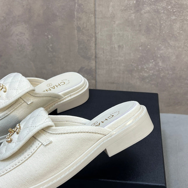CHANEL 26S MULE LOAFERS IN WHITE CANVAS WITH QUILTED FLAP & CC LOGO