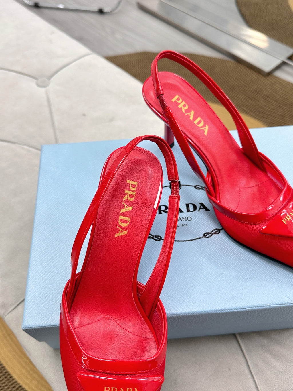 PRADA 25S TRIANGLE LOGO SLINGBACK PUMPS IN RED MESH FABRIC