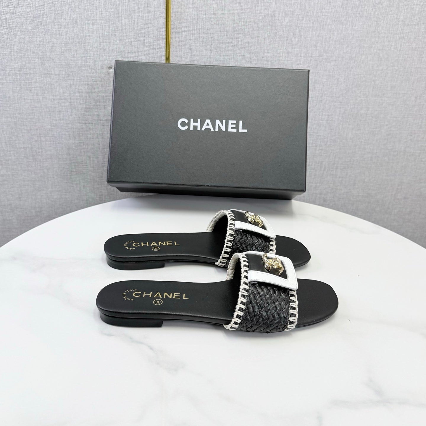 CHANEL 26S WOVEN STRAP SLIDES IN BLACK LAMBSKIN