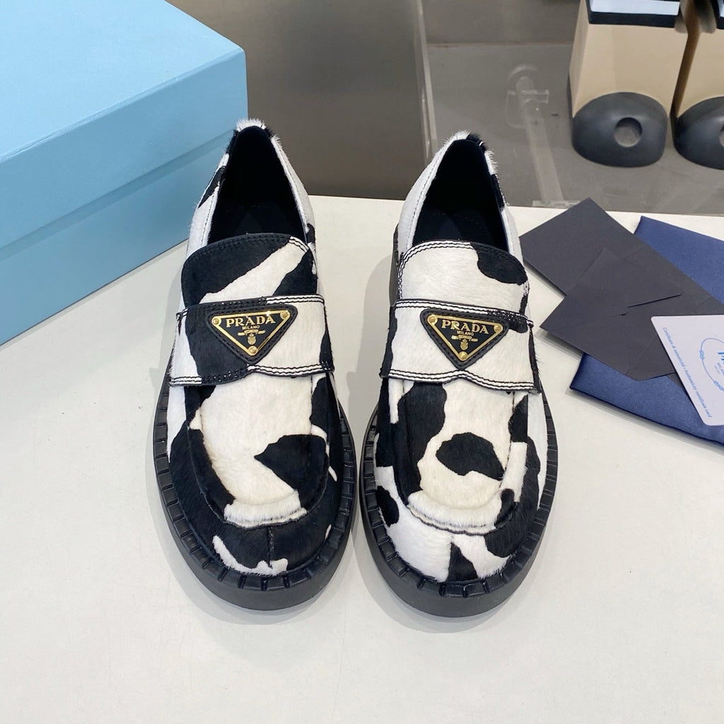 PRADA 26S LOAFERS IN WHITE AND BLACK COW PRINT PONY HAIR