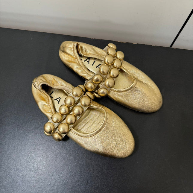 ALAIA SPHERE BALLET FLATS IN GOLDEN LAMBSKIN