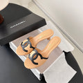 CHANEL MULES IN BEIGE AND BLACK CALFSKIN