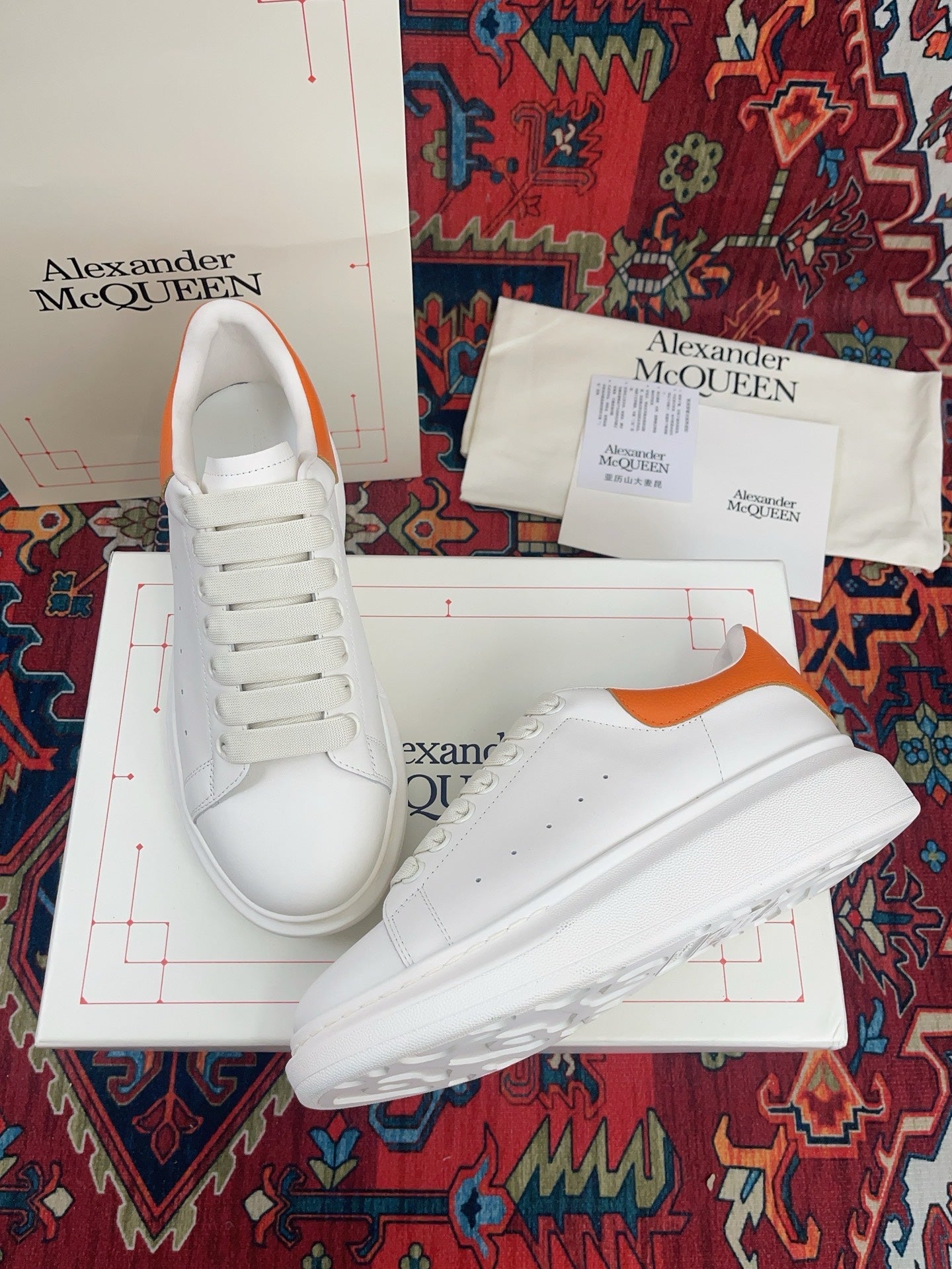 OVERSIZED SNEAKER IN WHITE CALFSKIN ORANGE HEEL TAB EMBOSSED LOGO