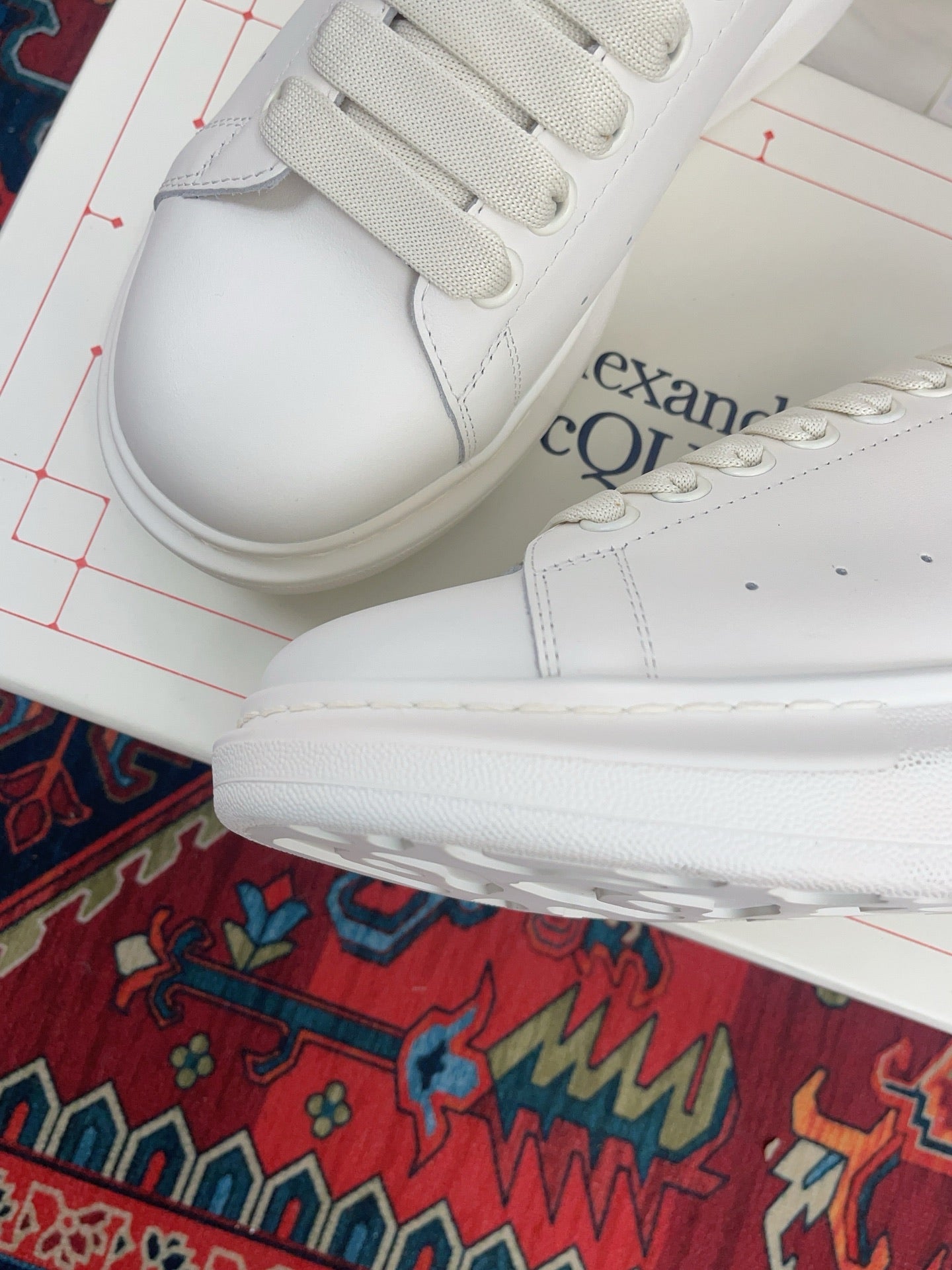 OVERSIZED SNEAKER IN WHITE CALFSKIN ORANGE HEEL TAB EMBOSSED LOGO