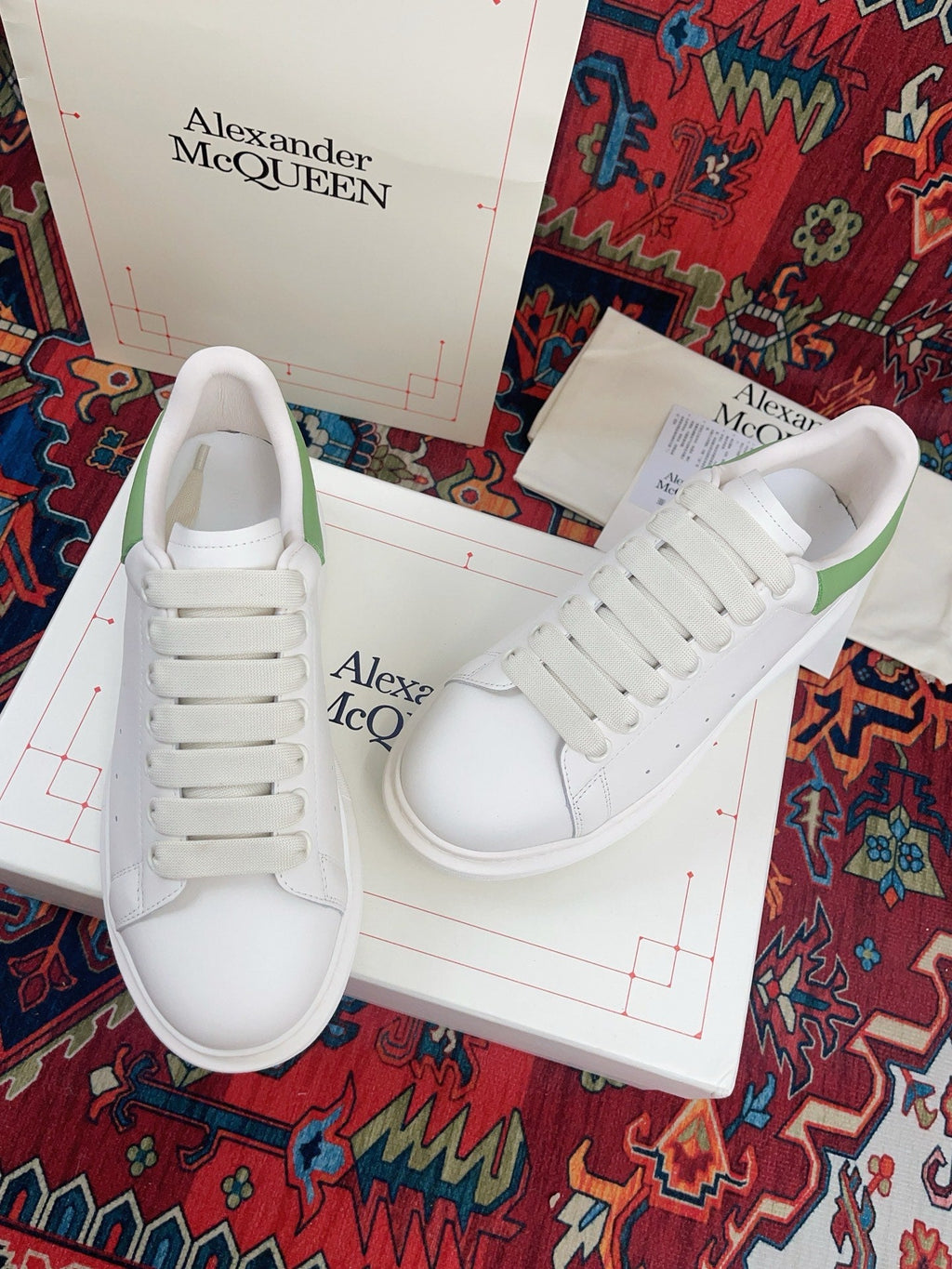 OVERSIZED SNEAKER IN WHITE CALFSKIN WITH EMBOSSED HUNTER GREEN HEEL TAB
