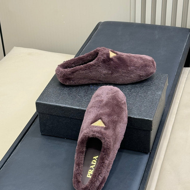 PRADA 25S CLOGS IN WINE RED SHEARLING