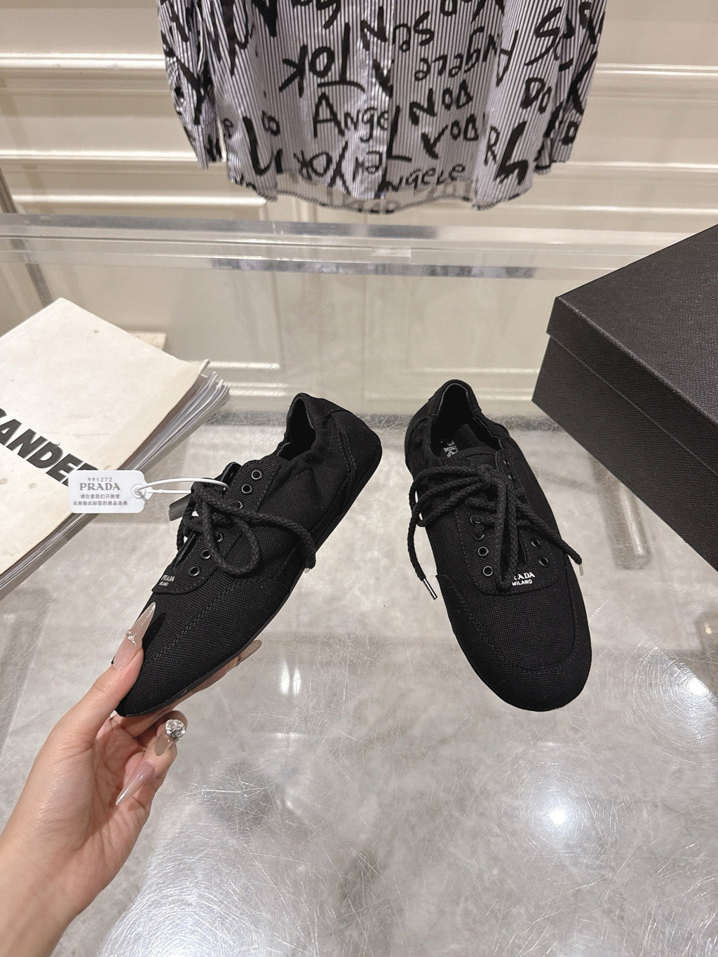 PRADA 26S COLLAPSE SNEAKERS IN BLACK CANVAS