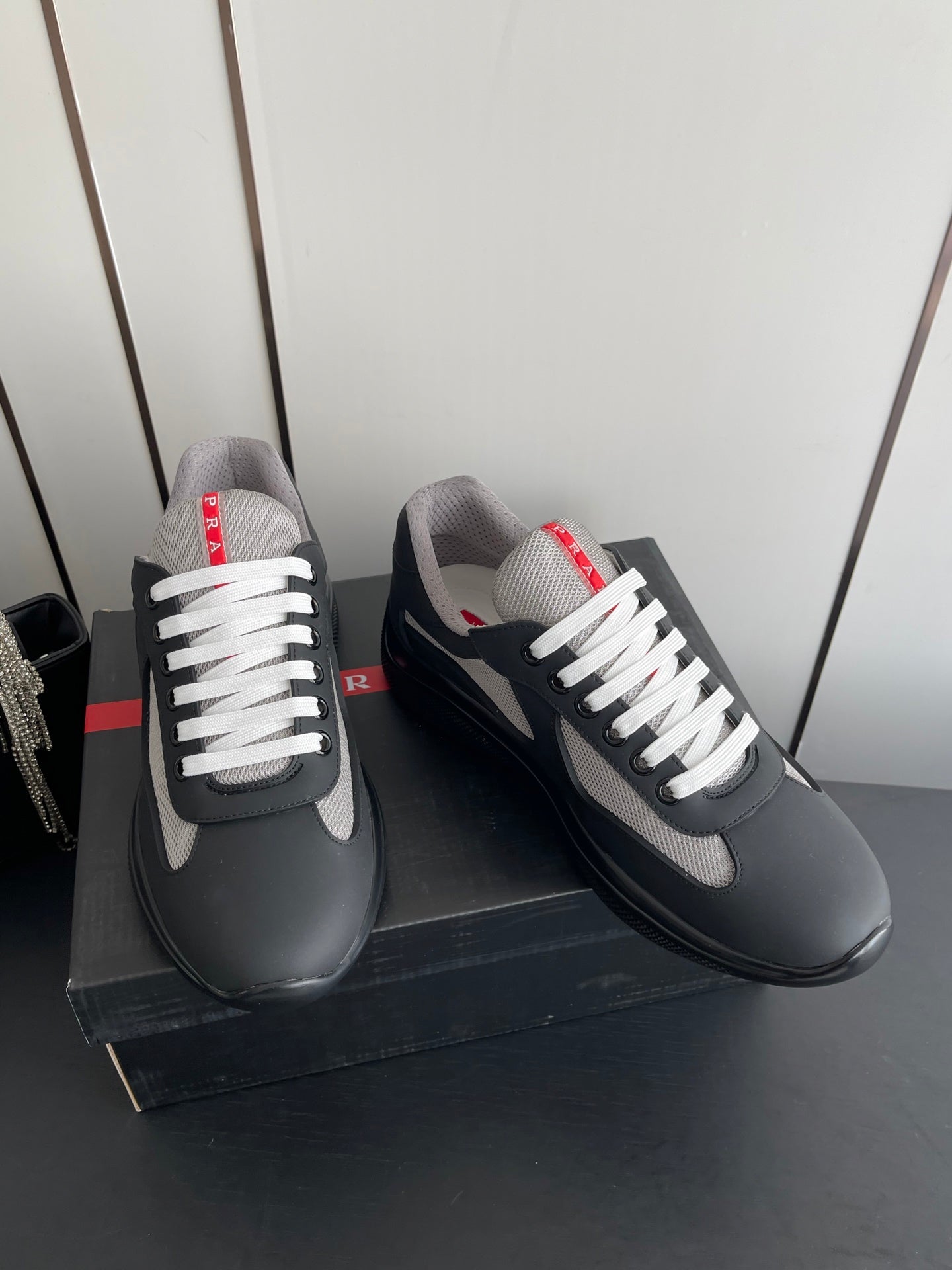 PRADA 26S AMERICA CUP SNEAKERS IN BLACK SOFT RUBBER AND BIKE FABRIC