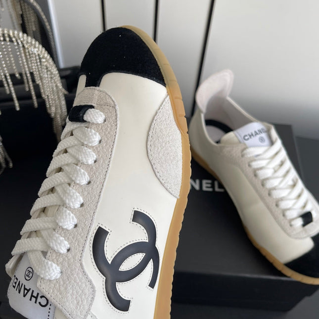 LOW-TOP SNEAKERS IN BLACK AND WHITE CALFSKIN MIX SUEDE
