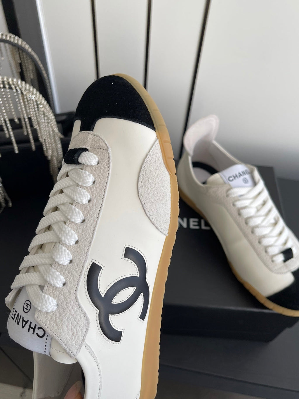 CHANEL LOW-TOP SNEAKERS IN BLACK AND WHITE CALFSKIN MIX SUEDE