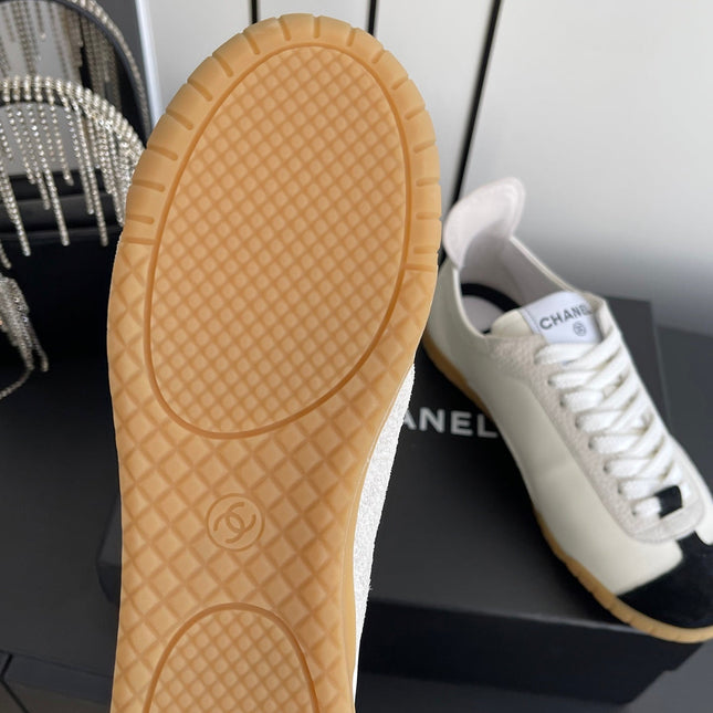 LOW-TOP SNEAKERS IN BLACK AND WHITE CALFSKIN MIX SUEDE