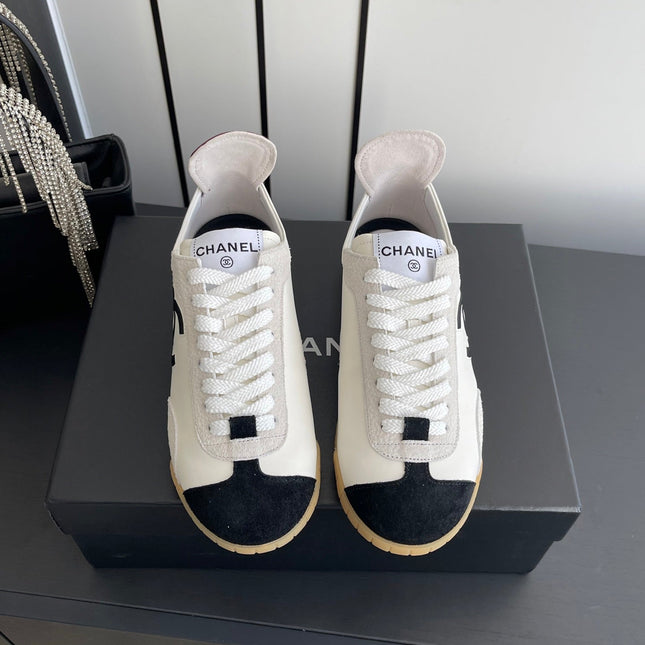 LOW-TOP SNEAKERS IN BLACK AND WHITE CALFSKIN MIX SUEDE