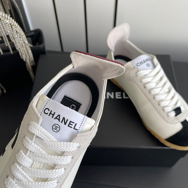 LOW-TOP SNEAKERS IN BLACK AND WHITE CALFSKIN MIX SUEDE