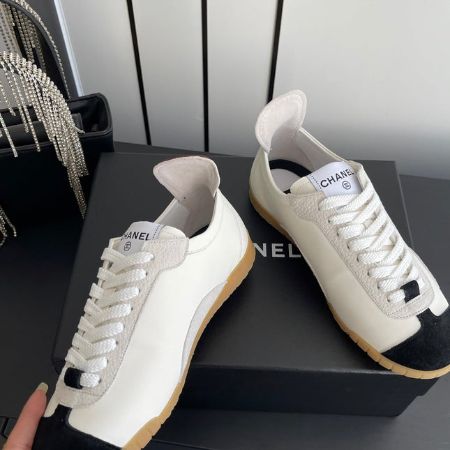 LOW-TOP SNEAKERS IN BLACK AND WHITE CALFSKIN MIX SUEDE