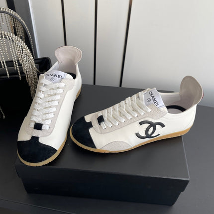 LOW-TOP SNEAKERS IN BLACK AND WHITE CALFSKIN MIX SUEDE