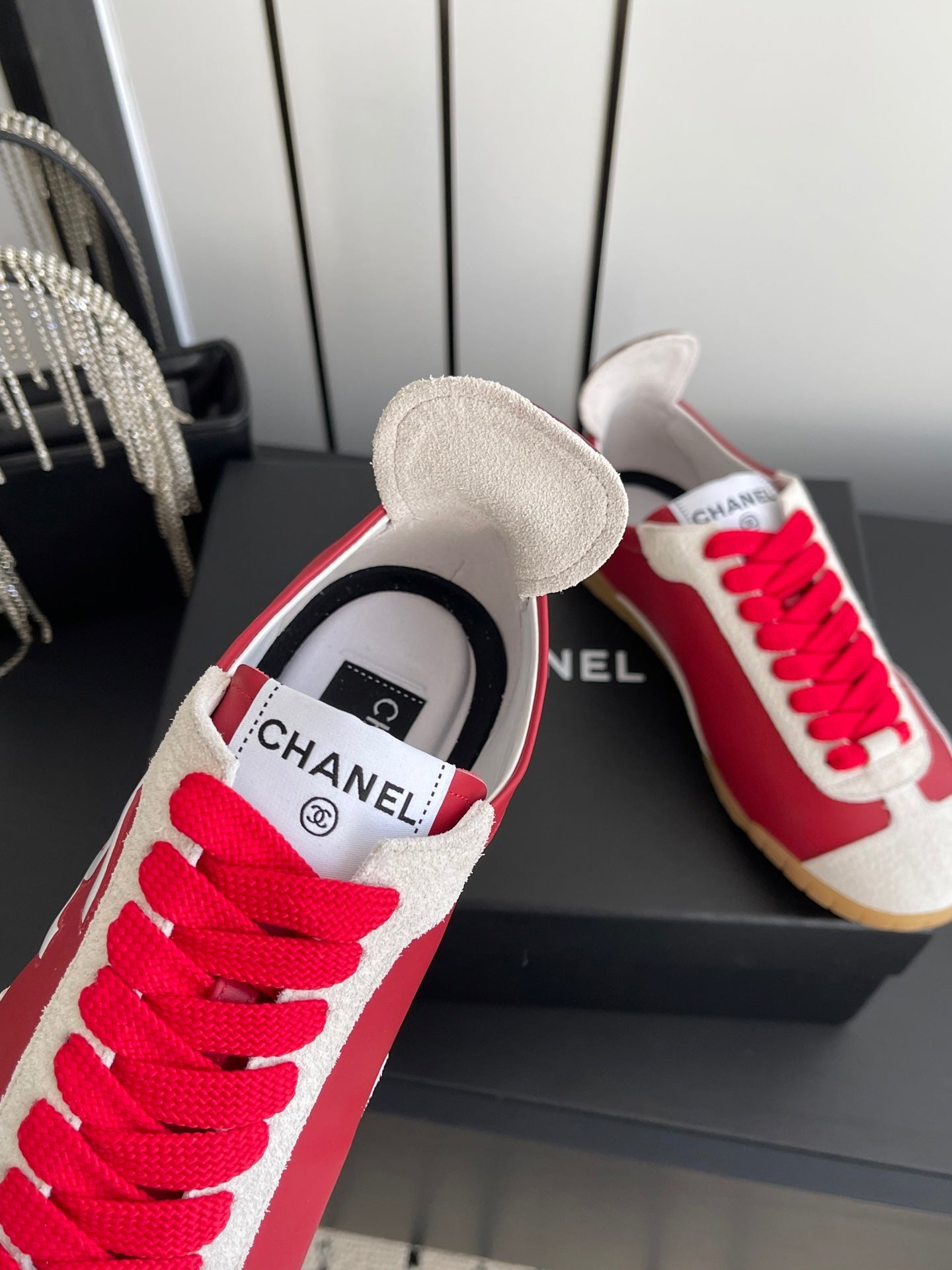 CHANEL LOW-TOP SNEAKERS IN RED CALFSKIN MIX SUEDE
