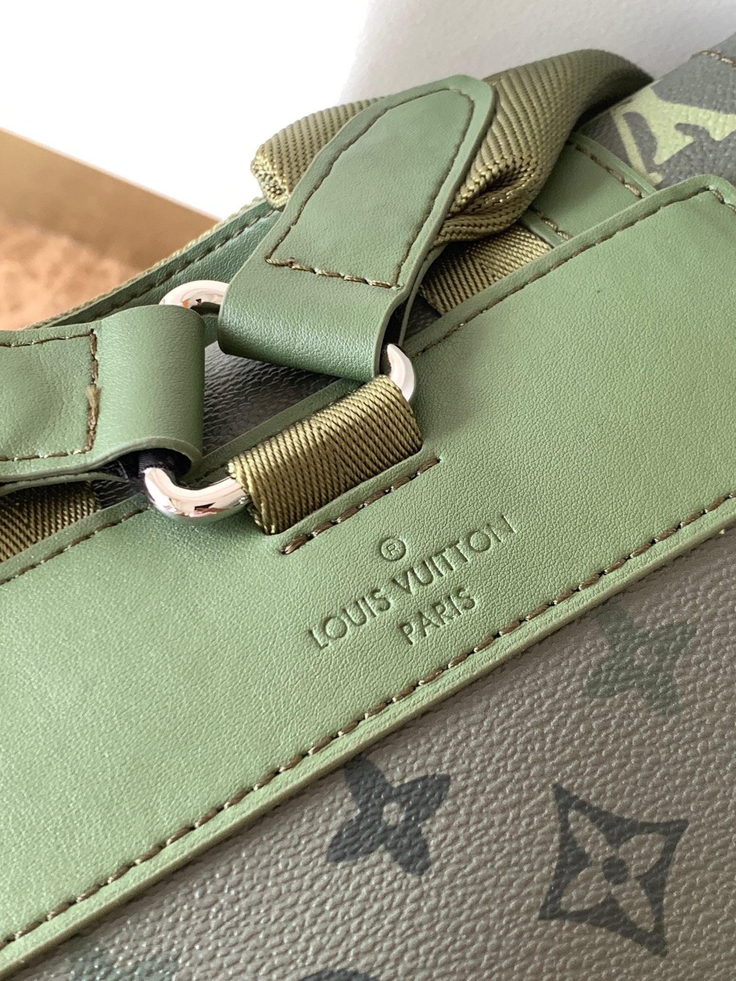 LV 25S CHRISTOPHER BACKPACK 48 IN ARMY GREEN CALFSKIN SILVER HARDWARE