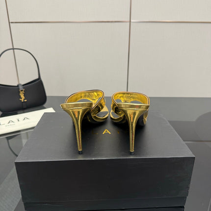 ALAIA HEELED THONG 25S IN GOLD PATENT LEATHER