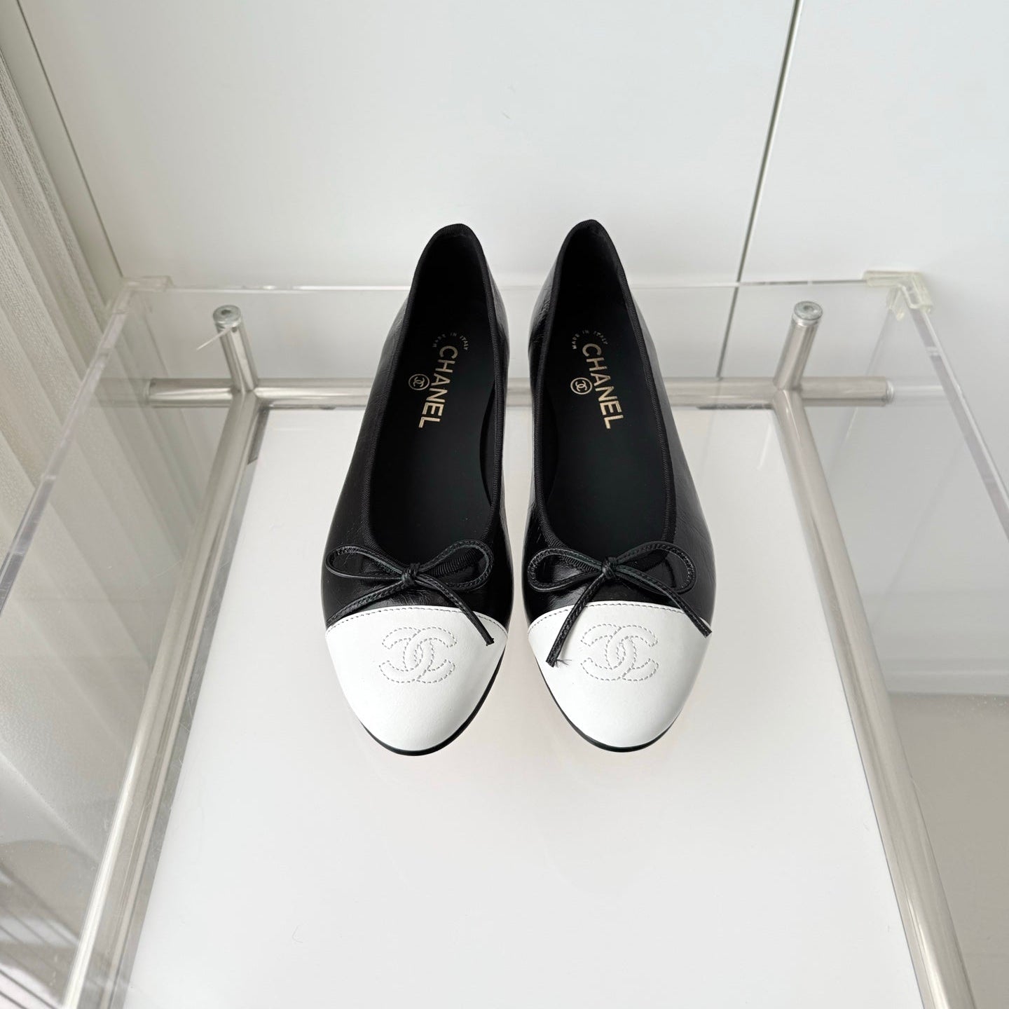 CHANEL 26S BALLET FLATS IN BLACK CRACKED CALFSKIN WITH WHITE TOE CAP AND BOW