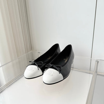 CHANEL 26S BALLET FLATS IN BLACK CRACKED CALFSKIN WITH WHITE TOE CAP AND BOW