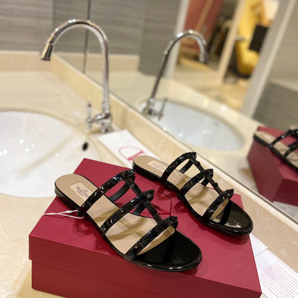 VALENTINO 26S ROCKSTUD CAGED SANDALS IN BLACK PATENT CALFSKIN