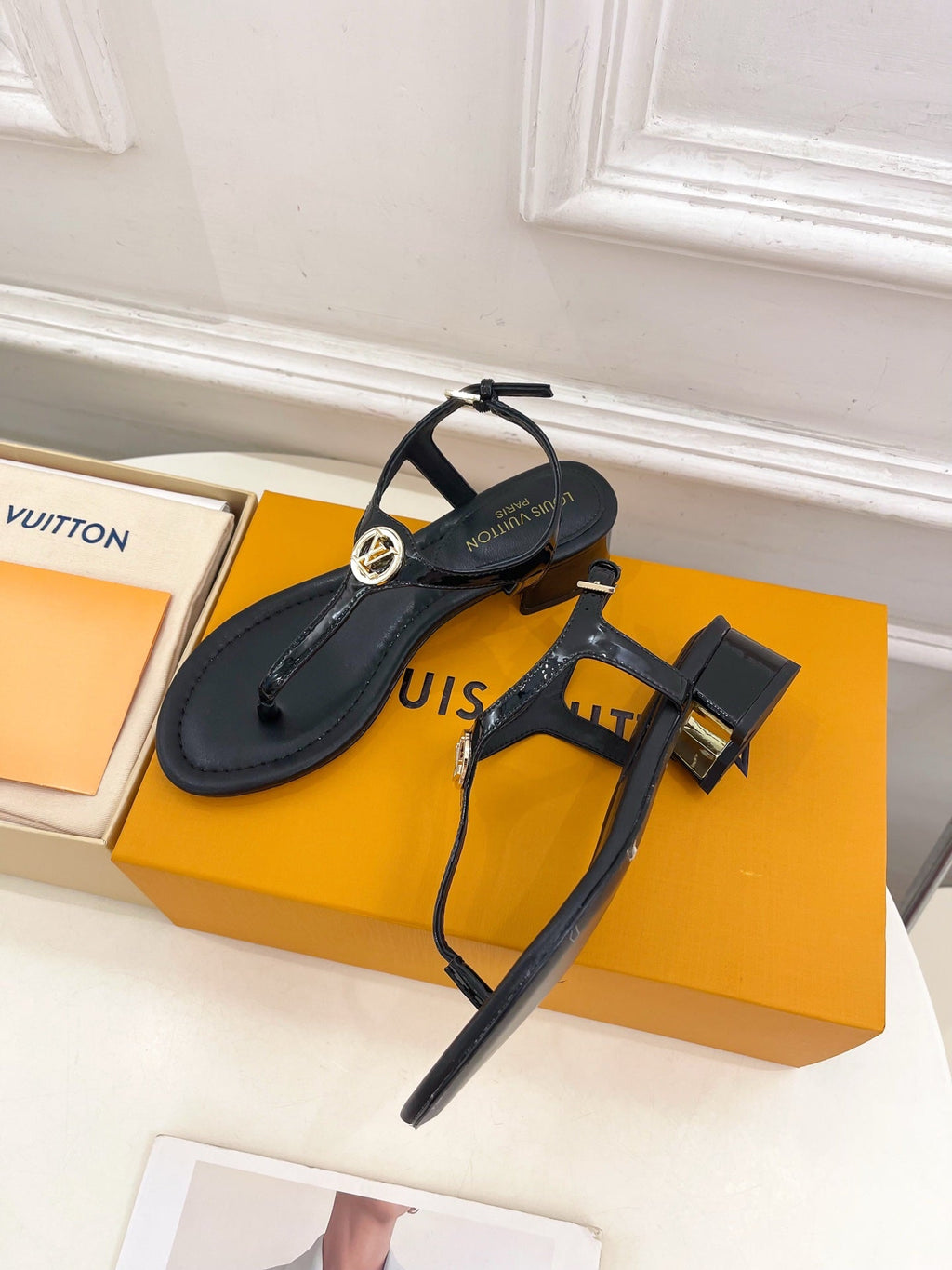 LV SUNKISS T-STRAP SANDALS IN BLACK CALFSKIN GOLD-TONE ACCESSORY.