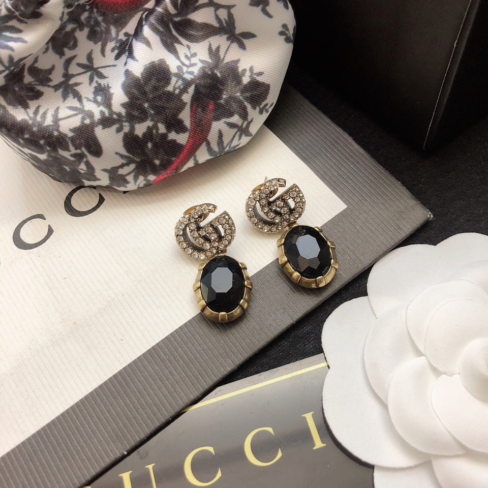 GUCCI 26S DOUBLE G LOGO BLACK CRYSTAL OVAL DROP EARRINGS IN ANTIQUE GOLD TONE METAL 6290262